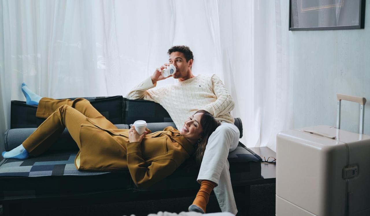 Lancemore Crossley St. Melbourne Exterior photo A couple relaxing at home